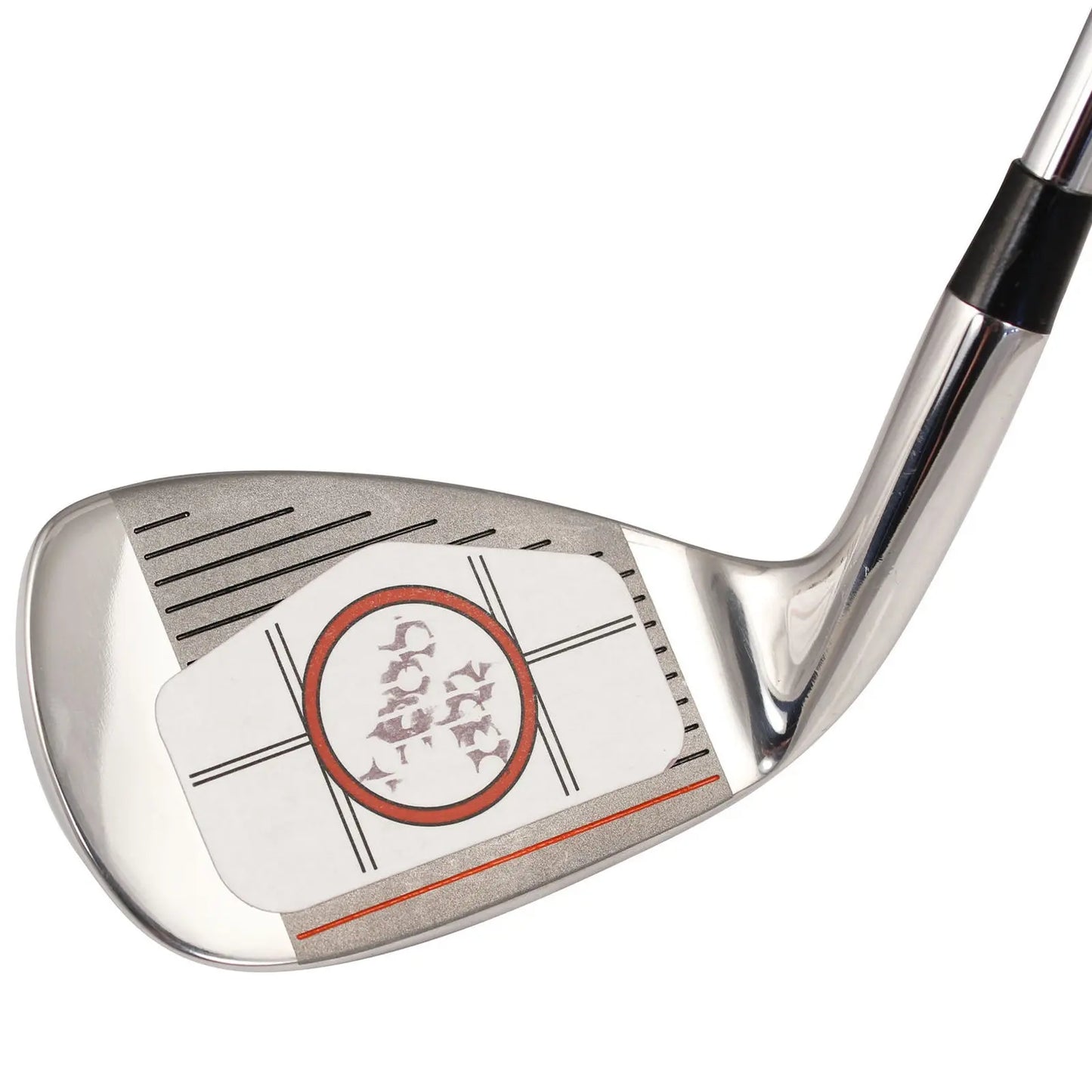 A golf club head rests on a surface featuring a white sticker with an outlined circle and marks showing impact zones used for swing analysis and improvement on a golf course setting.