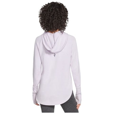 A person with curly hair is wearing a light purple hooded sweatshirt. They are facing away while standing, showcasing the sweatshirt's back design in a casual setting.