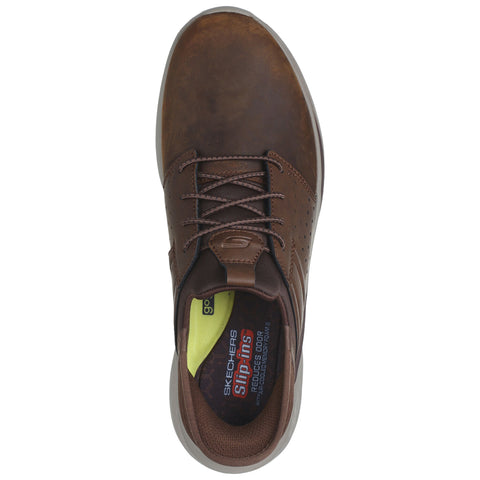 A brown casual shoe with a smooth leather texture laces up at the front and features perforated detailing located near the ankle in a simple background.