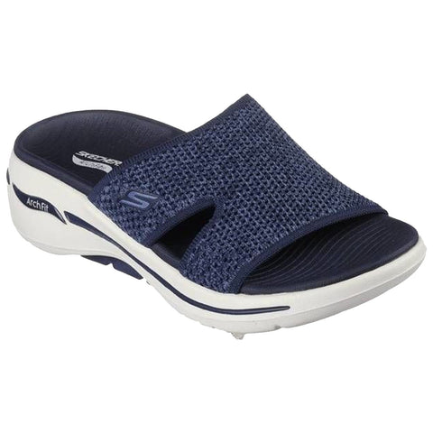 A navy blue slide sandal with a textured upper and open toe is positioned on a flat surface showcasing its breathable design and cushioned sole for comfort and support.