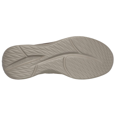 A shoe sole with a textured surface rests flat on a light background showcasing its tread pattern and the brand name Skechers embossed on the side.