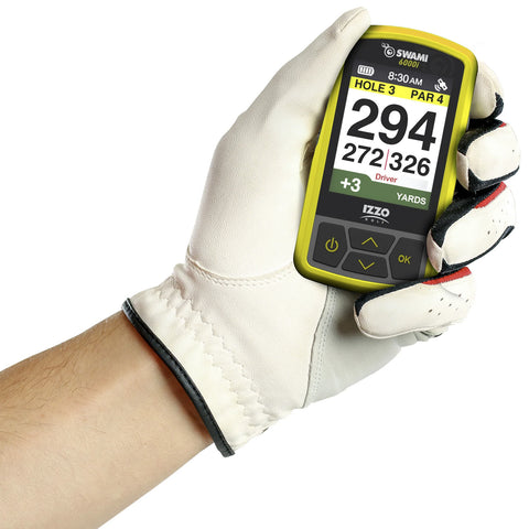 A hand wearing a white golf glove holds a yellow golf GPS device displaying the text HOLE 3 PAR 4 294 YARDS with additional yardage information indicating the context of golfing.