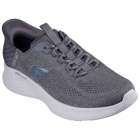 A gray athletic shoe is shown resting on a flat surface featuring a textured upper with laces and a cushioned sole designed for comfort and support during physical activities.