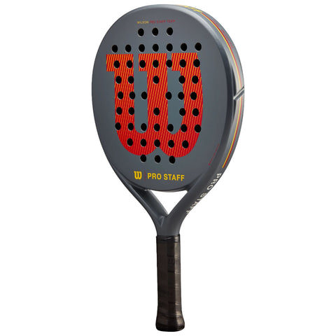 A paddle with a large round face featuring a prominent red and grey logo is poised for action, its black grip ready for use in a sports context.