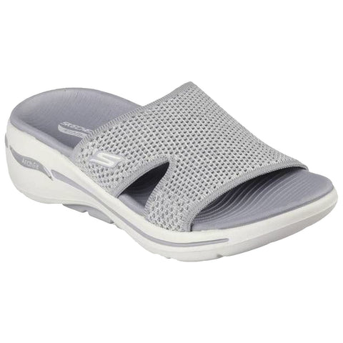 A gray slip-on sandal features a breathable mesh upper and a cushioned sole designed for comfort. It rests against a neutral background highlighting its modern design and functionality.