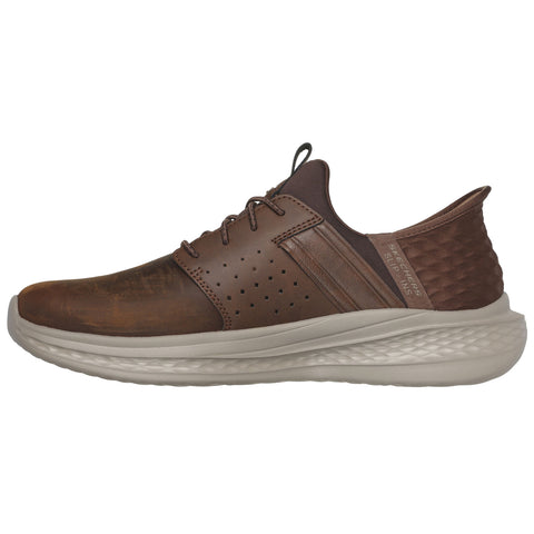 A brown sneaker features a smooth leather surface with perforations for breathability a cushioned sole for comfort and a streamlined design suitable for casual wear