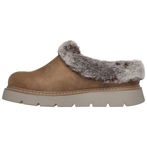 A brown slip-on shoe features a plush gray fur collar and a thick beige sole designed for comfort and warmth suitable for casual indoor or outdoor settings.