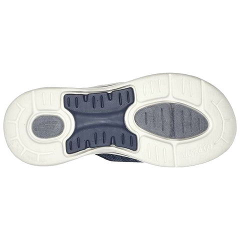 A sneaker sole features textured rubber for grip and cushioning The sole is predominantly white with dark blue elements showing wear patterns and is placed against a plain background