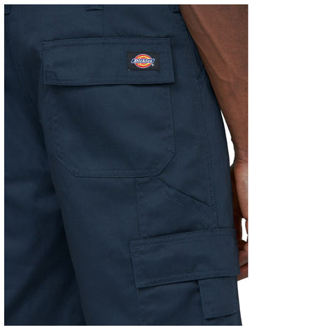 A pair of dark navy pants is displayed showing a close-up view of the side with visible pockets and the Dickies logo stitched on a patch