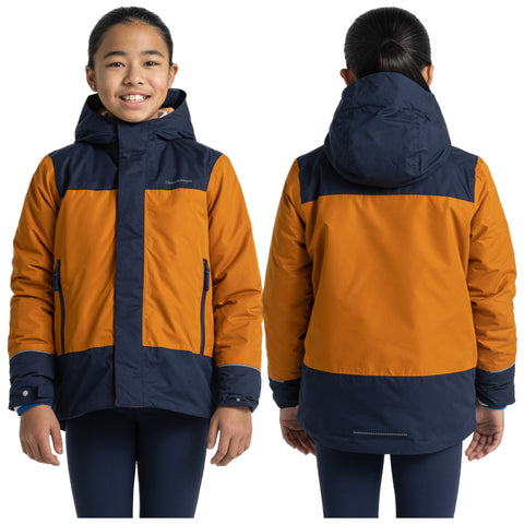 A child is smiling while wearing a two-toned orange and navy winter jacket with a hood in a neutral background showing the front and back of the jacket.