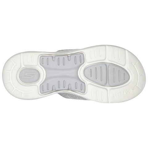 A gray shoe sole is shown with a textured white rubber bottom featuring a patterned design and branding visible on the side indicating its grip and support for walking or running.