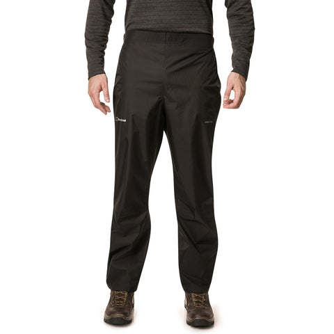 Black waterproof pants are worn by a person standing upright in a neutral pose in a plain background, suitable for outdoor activities in wet conditions.