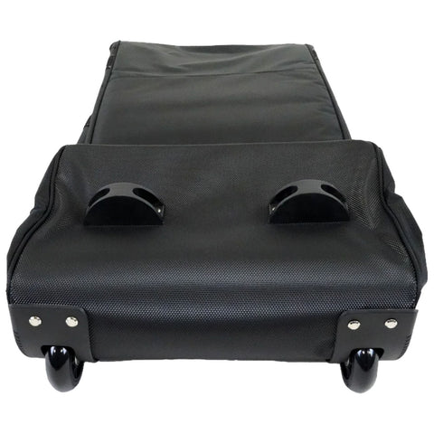 A black wheeled luggage case lies flat with handles on top and smooth wheels underneath showcasing a textured surface designed for easy mobility and transport often used for travel or storage