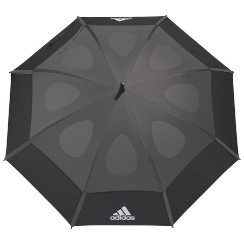 A black umbrella is opened with a smooth surface featuring teardrop patterns and an Adidas logo at the bottom section indicating it is designed for protection against rain or sun.