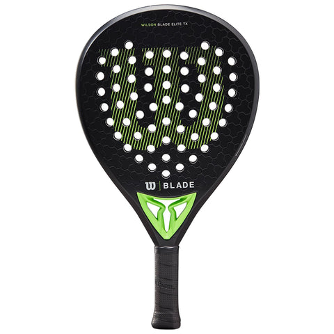 A paddle is shown resting on a flat surface showcasing a black head with green accents and a textured grip handle featuring a logo and perforations throughout the surface