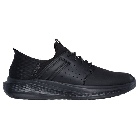 A black athletic shoe with a sleek design features a smooth surface and a textured heel. It has laces and perforations for breathability, suitable for casual wear or light exercise.