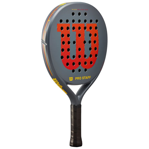 A padel racket with a gray surface features a large red "W" logo and multiple holes for enhanced performance resting on a black grip within a blank background.