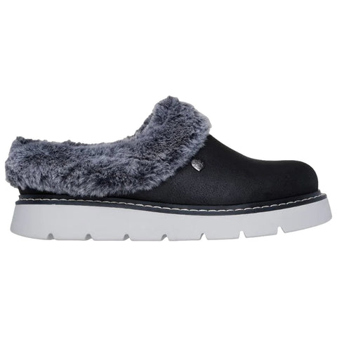 A black slipper with a plush gray fur lining sits on a white background featuring a thick white sole and black trim designed for comfort and casual wear.