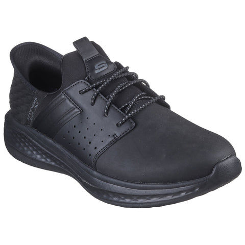 A sleek black athletic shoe is positioned at an angle with textured panels and laces prominently displayed indicating a design for comfort and style in various active contexts.