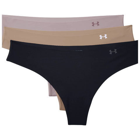 Three pairs of women's underwear are displayed with the black pair in the foreground and two nude shades behind them the fabric appears smooth and stretchy with the Under Armour logo on each pair