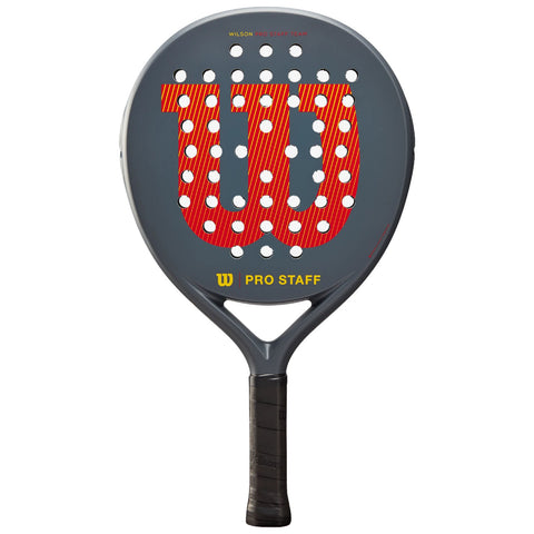 A paddle racquet features a circular head with holes for improved playability and a textured black grip handle. It is designed for sports like paddle tennis, showcased against a neutral background.
