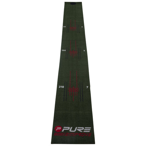 A long green mat designed for practice features markings for distances 90 150 and 210 with additional indicators for improving skills and a logo at the bottom reading PURE.