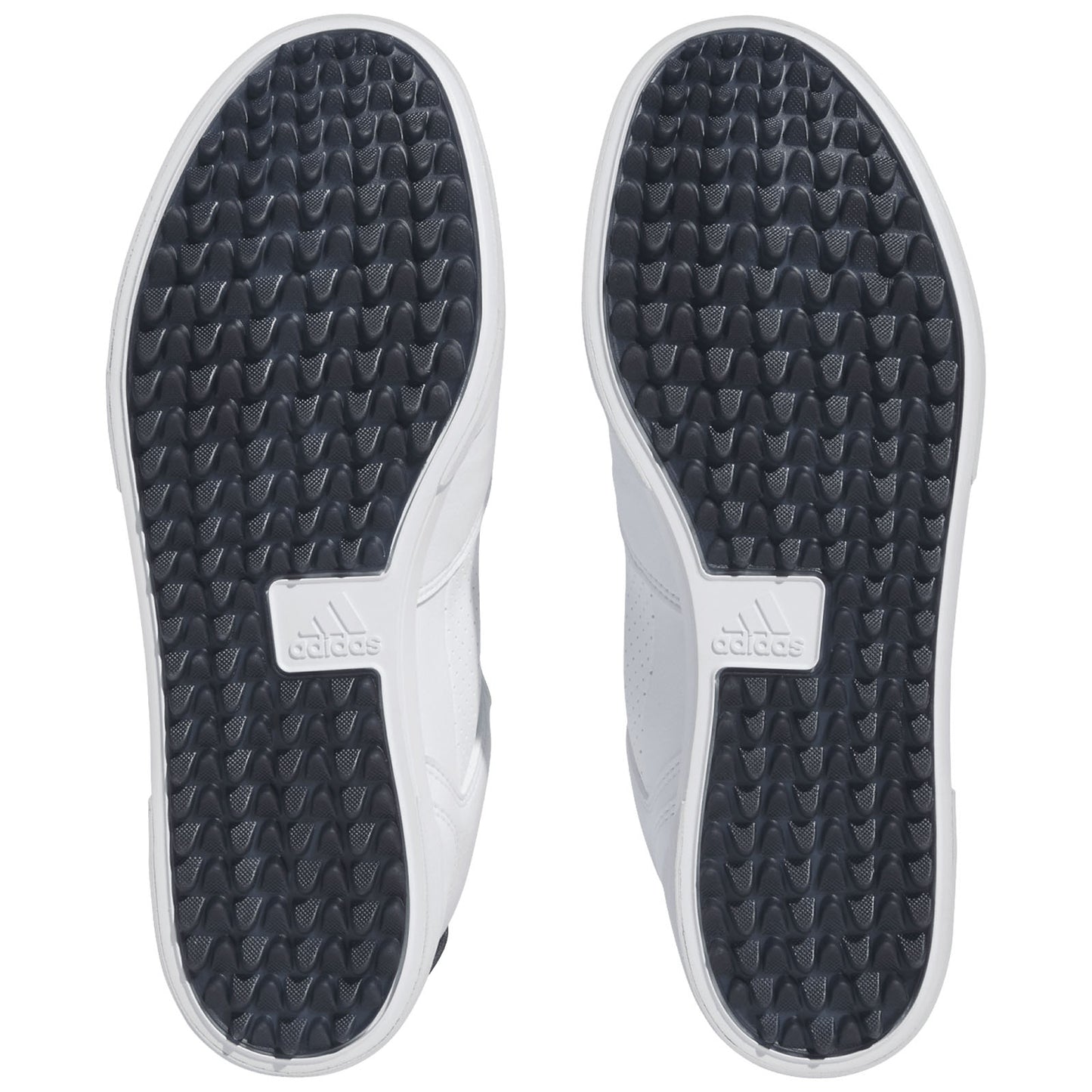 Two shoe soles are displayed with a white and black color scheme featuring a textured surface for grip. The surrounding environment is neutral and lacks any distinct elements.