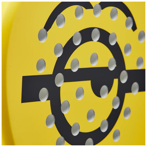 A circular yellow object features a design of large connected circles and horizontal lines with evenly spaced metallic dots creating a textured surface, likely intended for visual or tactile interaction.