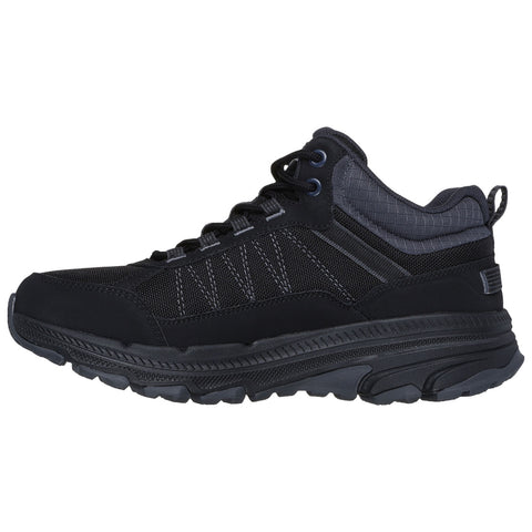 A black sneaker with a textured upper is displayed upright showing its lacing system and cushioned sole suitable for casual wear or light outdoor activities.