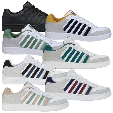 A white sneaker with gray and navy stripes rests on a flat surface featuring a yellow accent at the heel and white laces, designed for casual wear.