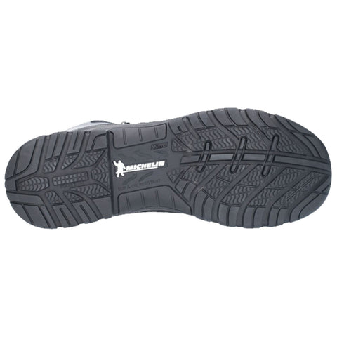 A black rubber shoe sole displays a textured tread pattern with a prominent logo and the words slip and oil resistant indicating its design for safety and traction in various environments.