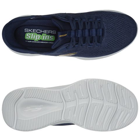 A navy blue slip-on shoe features a breathable mesh upper with a textured surface and laces. The white rubber sole has a grooved pattern for traction, suitable for casual wear.