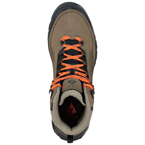 A brown hiking boot with orange laces is positioned upright showing its detailed design and textured surface against a plain background emphasizing its rugged appearance and durability.