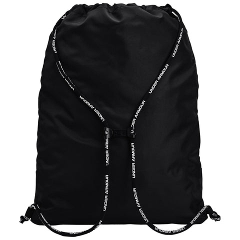 A black drawstring backpack rests flat with a gathered top and adjustable straps featuring the brand name Under Armour printed in white. It is designed for carrying items conveniently.