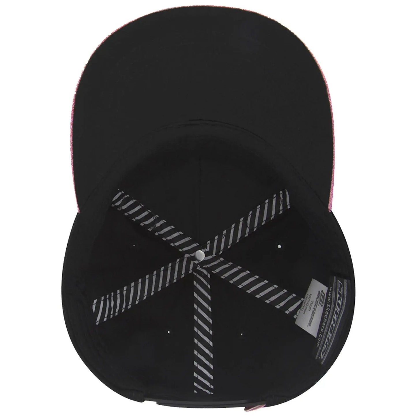 A black baseball cap with a pink brim lies on a flat surface showcasing its interior structure including black fabric and striped stitching lines with a circular button at the top.