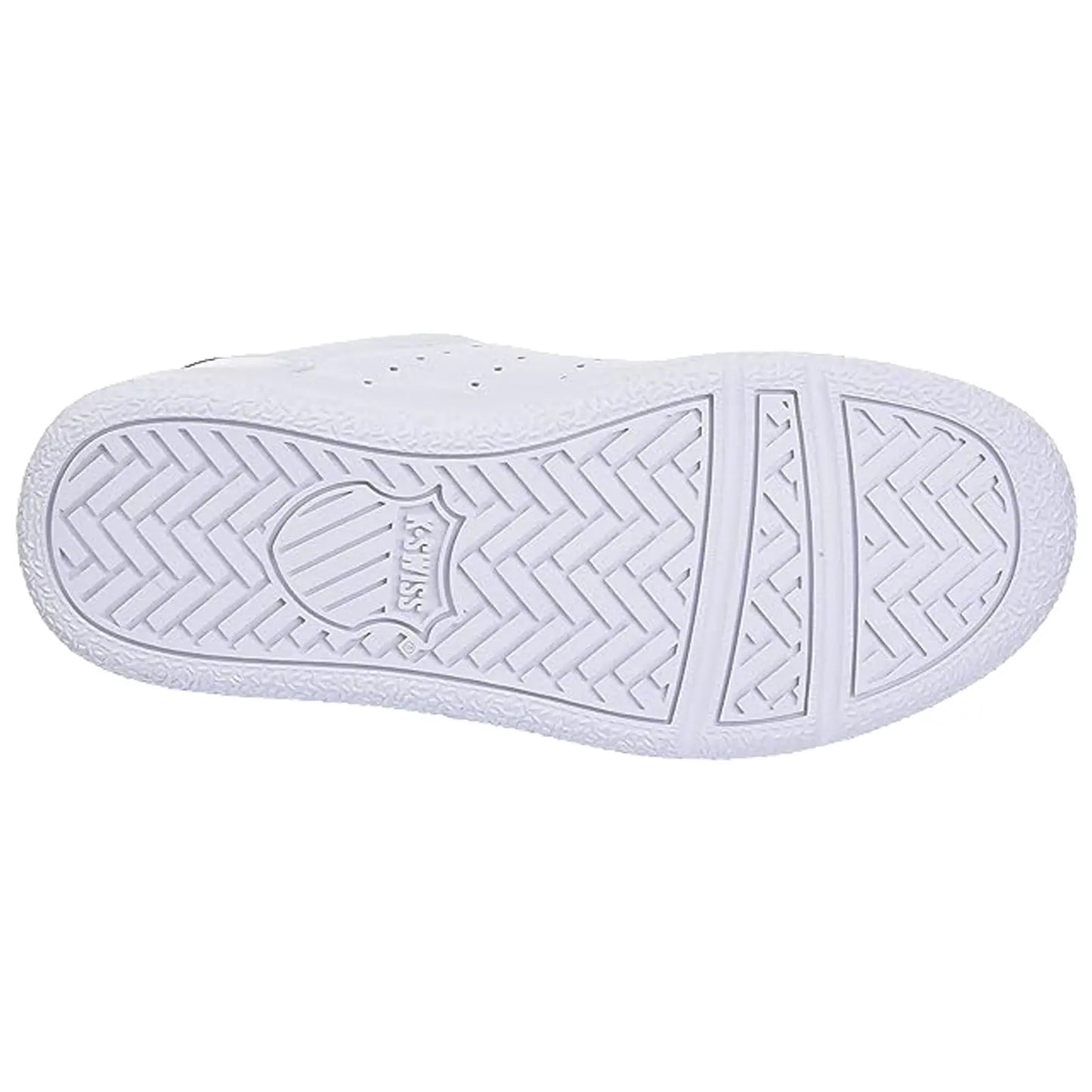 A white sneaker's sole is displayed with a textured pattern featuring a circular logo at the center and a herringbone design providing traction and grip for various surfaces.