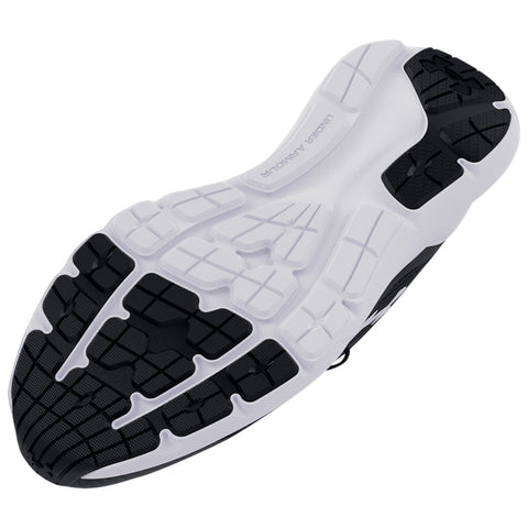A black and white athletic shoe sole is depicted resting on its side showcasing a textured design for grip and durability in a neutral background with no distinct features.
