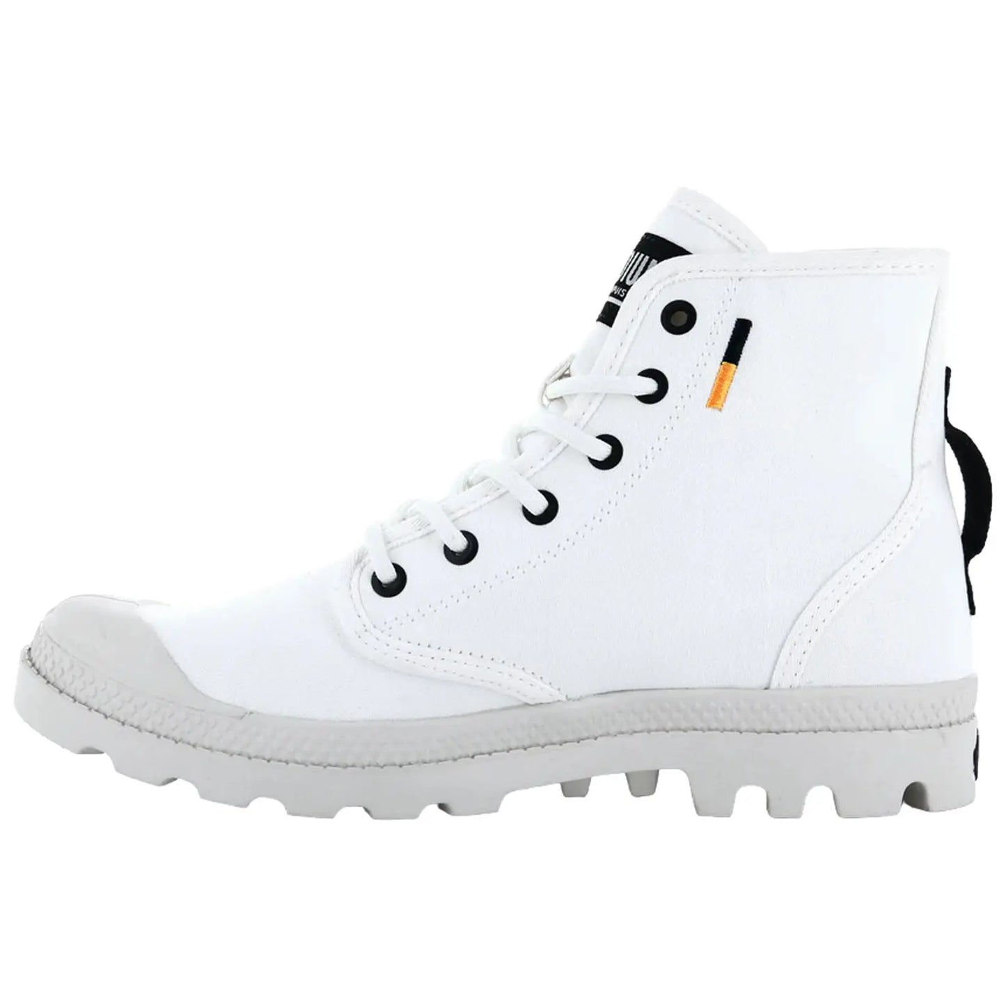 A white high-top shoe features a canvas upper and rubber sole with a textured grip showing black eyelets and a pull tab on the back in a simple studio setting.