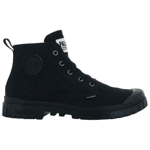 A black high-top shoe features a textured fabric upper and a thick rubber sole with a logo patch on the side and a label on the tongue in a neutral setting.