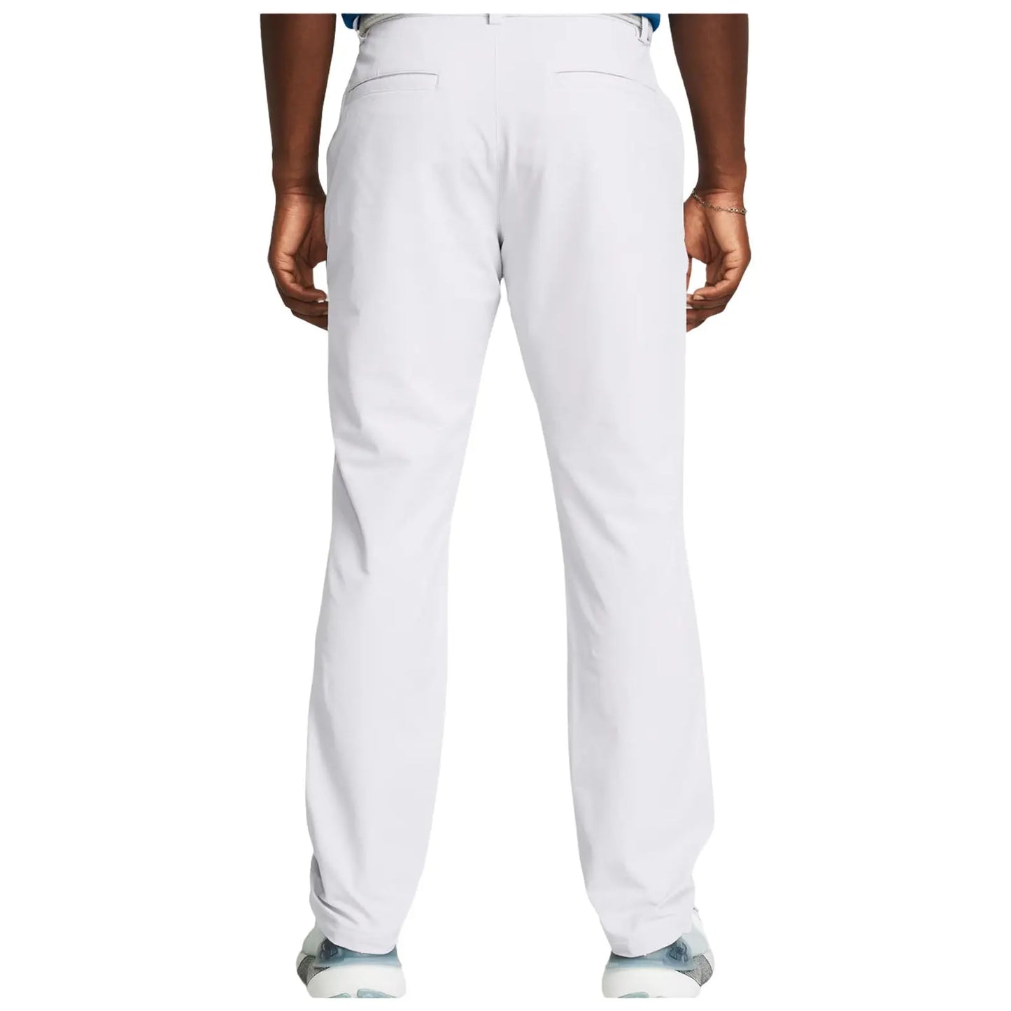 Light-colored pants are worn by a person standing with their back facing the viewer in a neutral background highlighting the pants and shoes visible at the bottom.