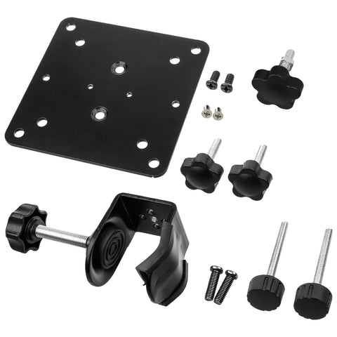 A black mounting plate is surrounded by various hardware components including knobs screws and a clamp used for securing the plate in place within a setup environment.
