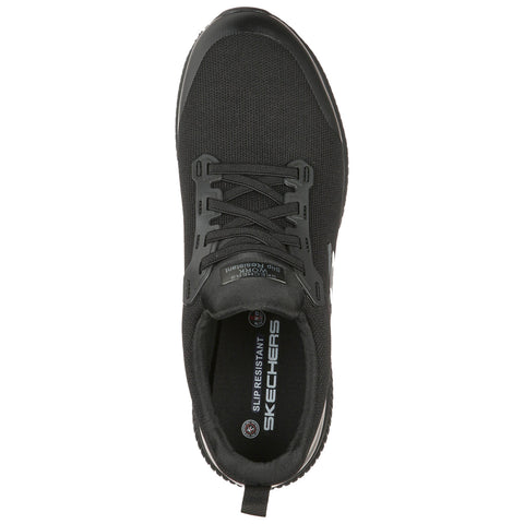 A black sneaker with a textured upper laces through eyelets rests flat. The insole features "SKECHERS" and "SLIP RESISTANT" indicating functionality. Designed for comfort and safety in various environments.