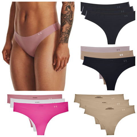 A person wearing a pink thong is standing with their arm at their side surrounded by various styles and colors of underwear including pink black and beige options arranged in groups.