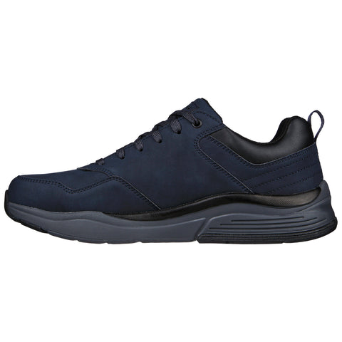 A navy blue athletic shoe with a smooth upper surface is displayed angled to the side featuring a cushioned sole and laces designed for casual wear and comfort.