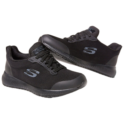 Two black athletic shoes with a breathable mesh design are positioned together against a plain background showcasing their laces and textured soles indicating a focus on comfort and performance.