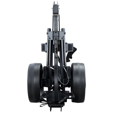 A compact wheeled cart stands upright with a vertical frame and attached brackets visible at the top designed for transporting equipment in various settings.