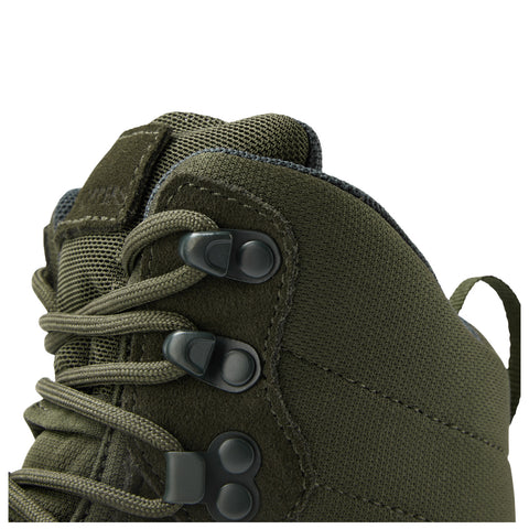 A green shoe is displayed highlighting its laces and hooks where the laces are threaded through the hooks for secure fastening in an undefined background.