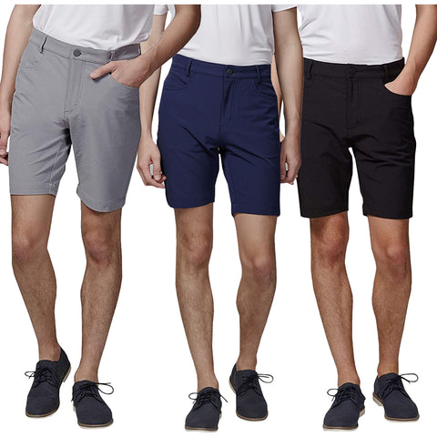 Three pairs of shorts in light gray navy blue and black are displayed on male figures standing side by side each wearing casual shoes their hands rest in pockets or by their sides