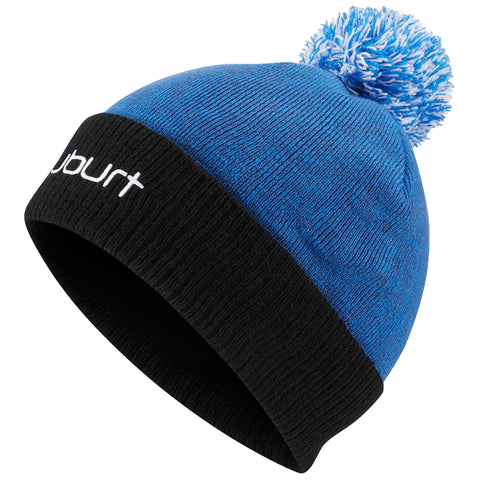 A blue knit beanie with a blue and white pom-pom on top is displayed at an angle showcasing its black brim and white logo text on the front.