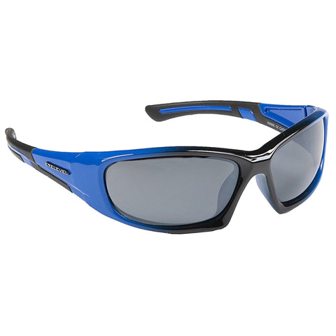 Sporty sunglasses with a blue and black frame rest on a flat surface the lenses are tinted dark which suggests they are designed for outdoor use in bright conditions